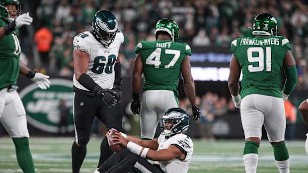 Jets' DE Bryce Huff (47) walks away after sacking Eagles' QB Jalen Hurts